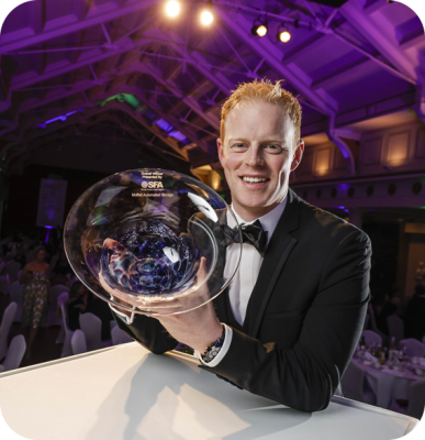 Ground-Breaking-Irish-Innovation Sam Moffett holding the SFA National Small Business Award at a gala event
