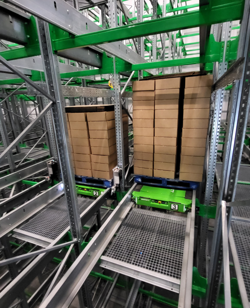 Two taxis carrying pallets
